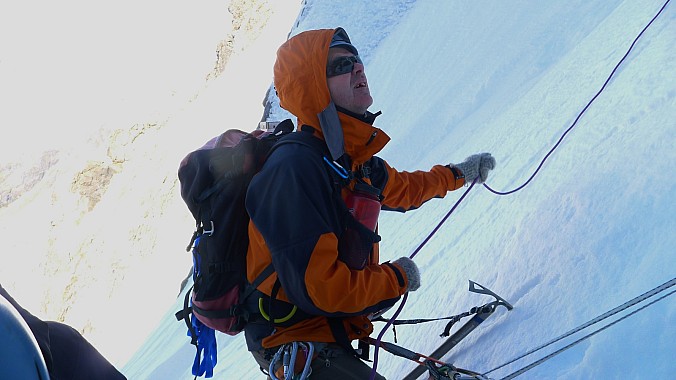 Stu belaying in cool shady conditions
