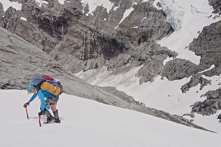 Climbing steep snow slopes to Arawhata Saddle